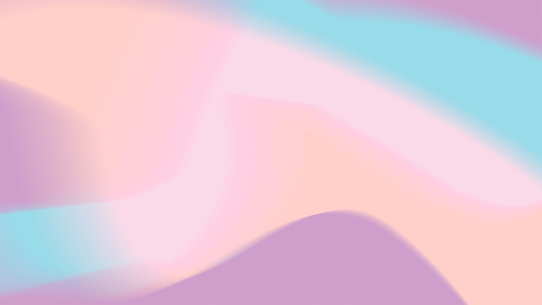 A blurry image of a pink and blue background
